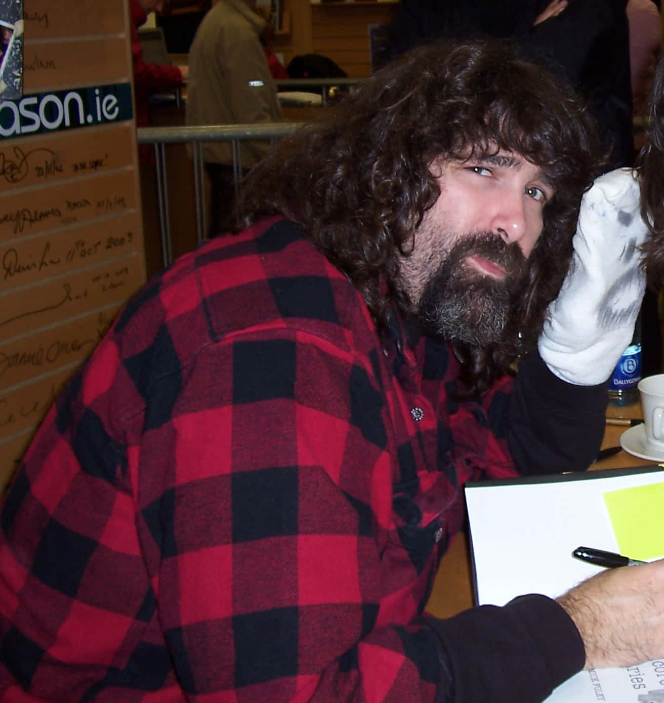 American Former Wrestler Mick Foley Engaging With Fans At A Book Signing Event Background