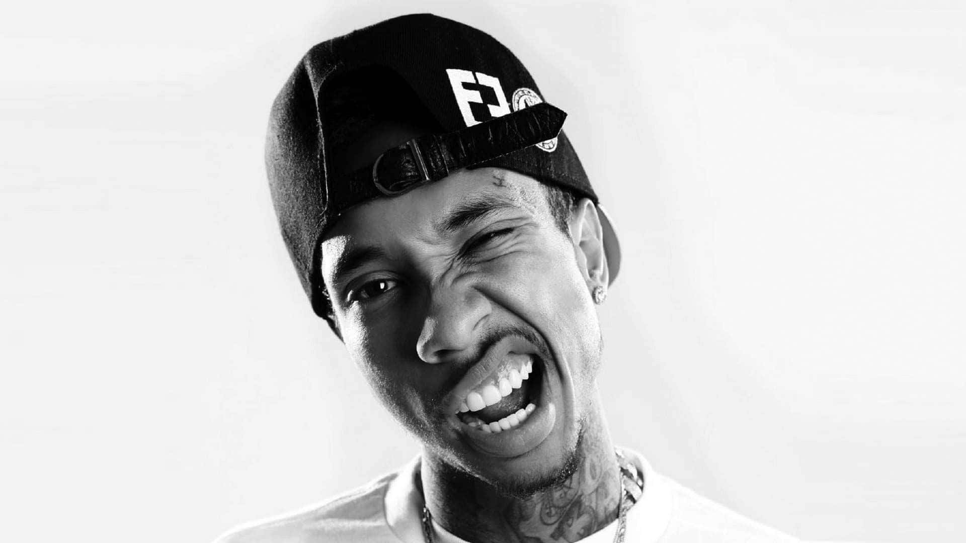 American Hip Hop Artist Tyga Raps In The Studio Background