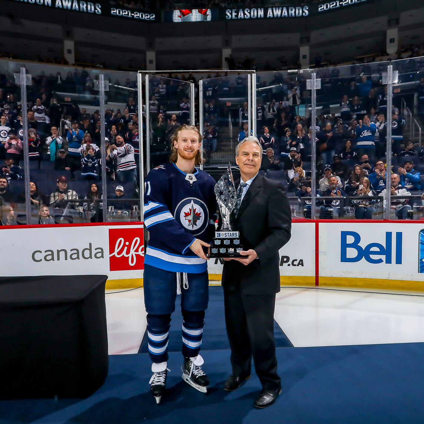 American Ice Hockey Player Kyle Connor With Three Stars Award Background