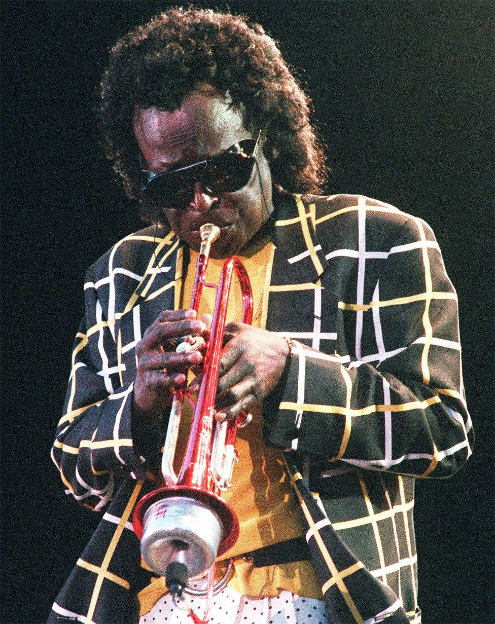 American Jazz Legend Miles Davis Playing Trumpet Background