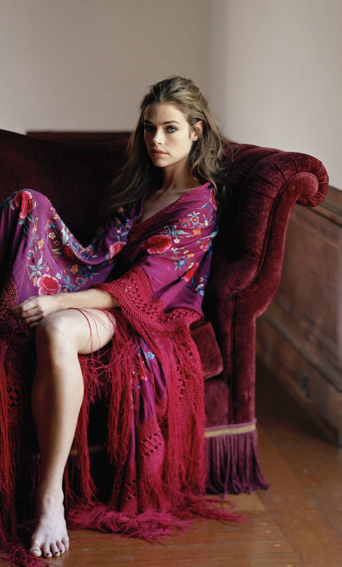 American Model Denise Richards Velvet Sofa Pose Background