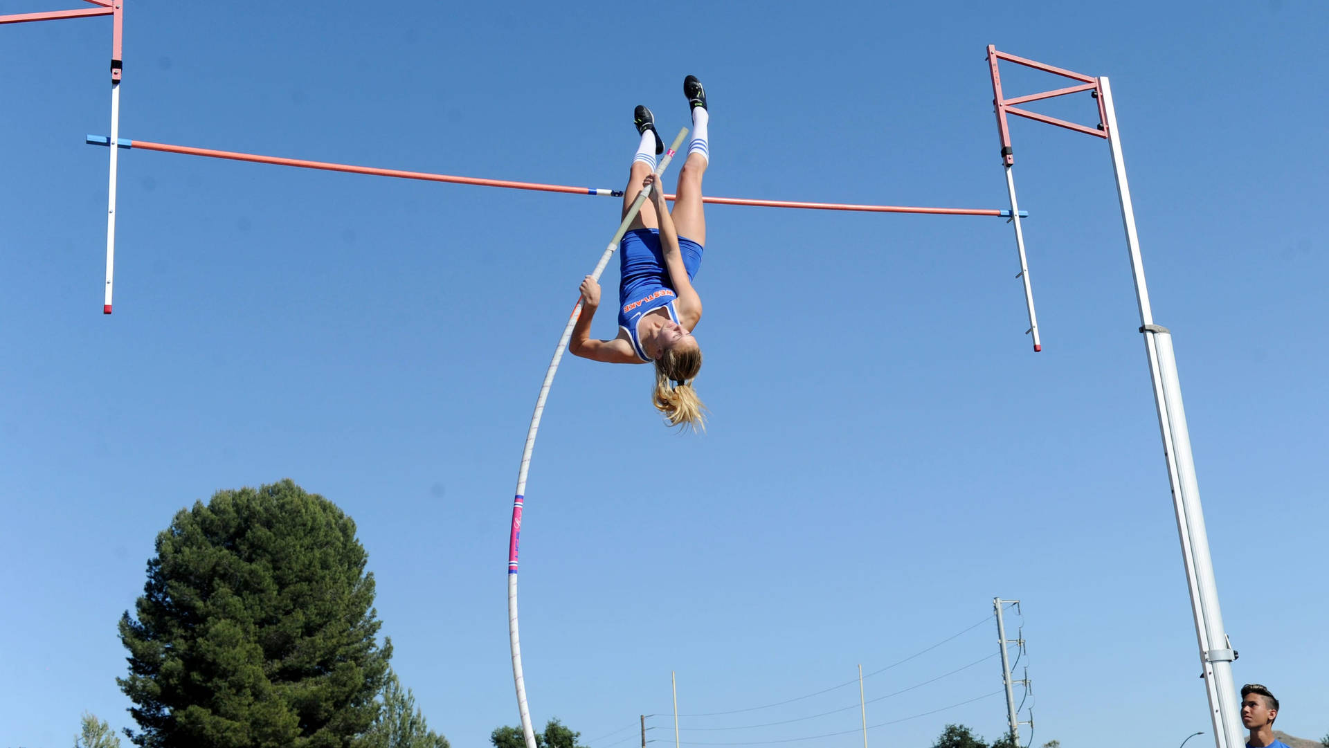 American Pole Vault Athlete Paige Sommers In Action Background