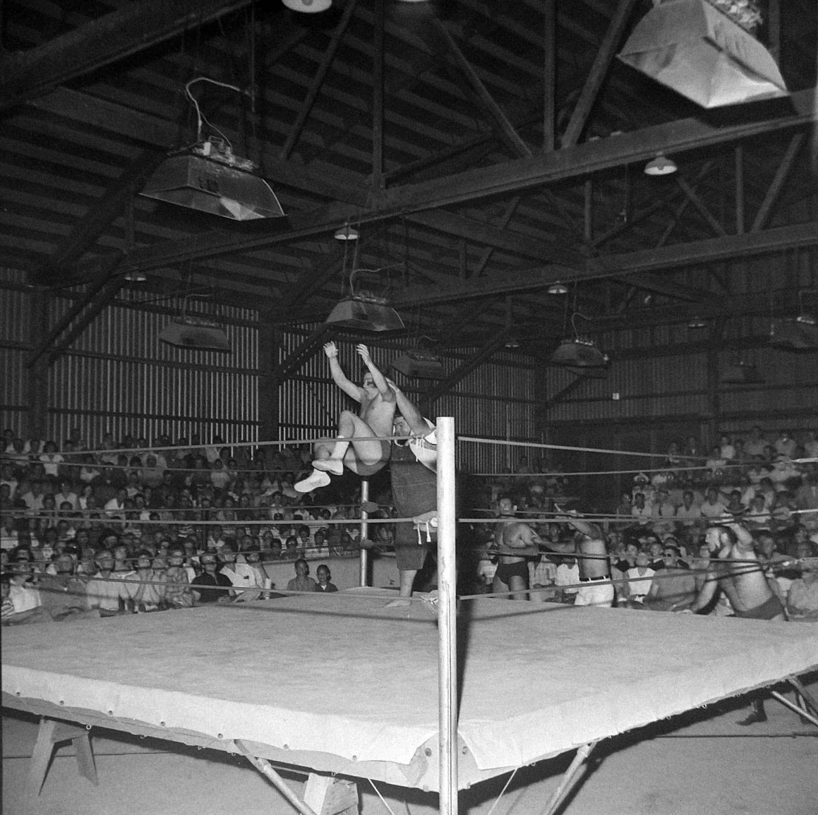 American Professional Wrestler Haystacks Calhoun In Fairgrounds Expo Background