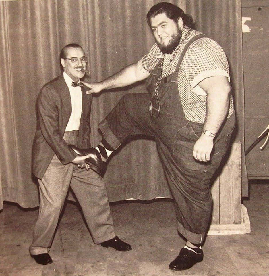 American Professional Wrestler Haystacks Calhoun With Comedian Groucho Marx Background