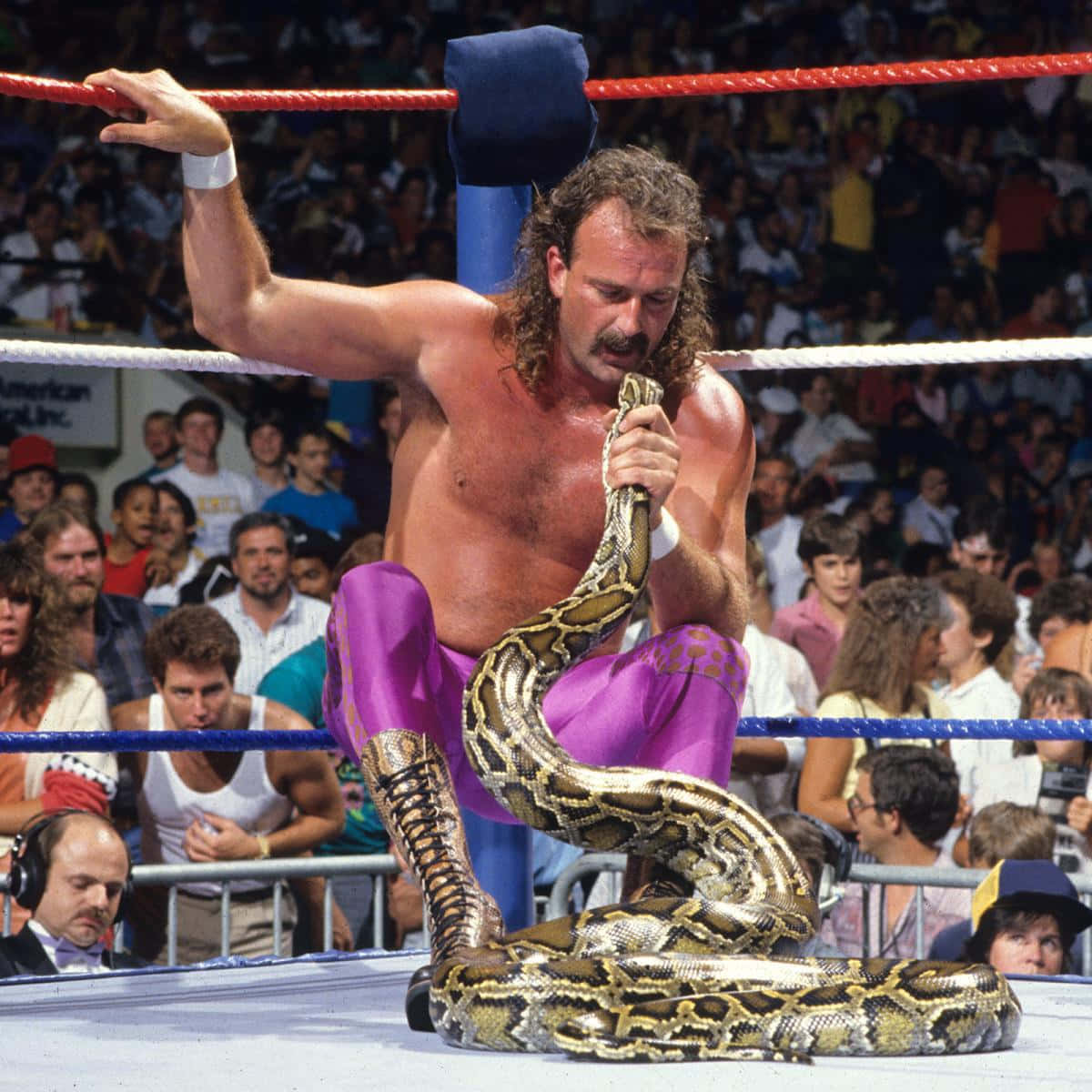 American Professional Wrestler Jake Roberts Staring At Damien Background