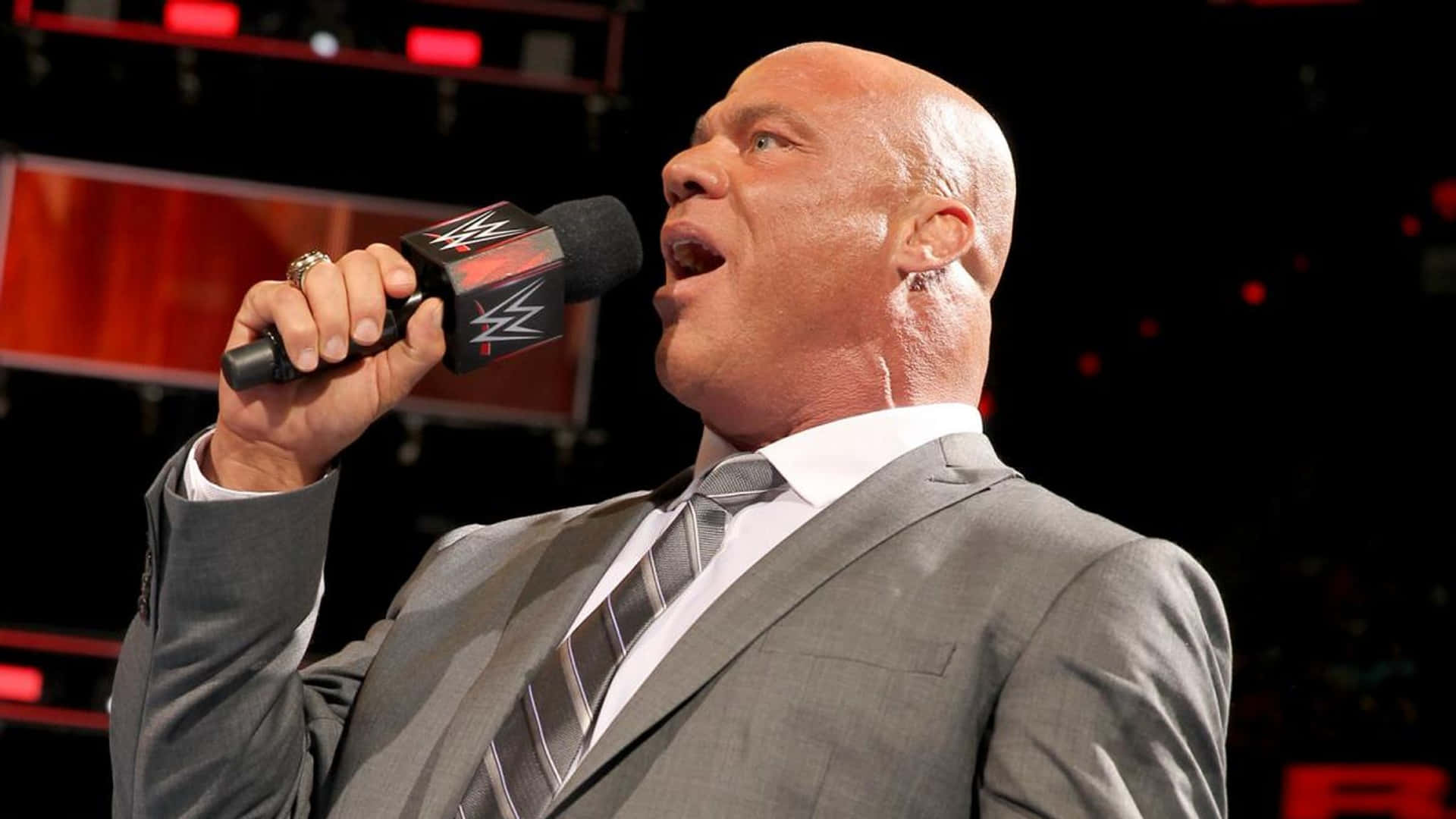 American Professional Wrestler Kurt Angle Addressing The Crowd Background