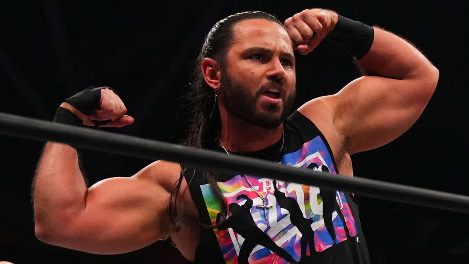 American Professional Wrestler Matt Jackson Showcasing His Signature Flexing Pose. Background