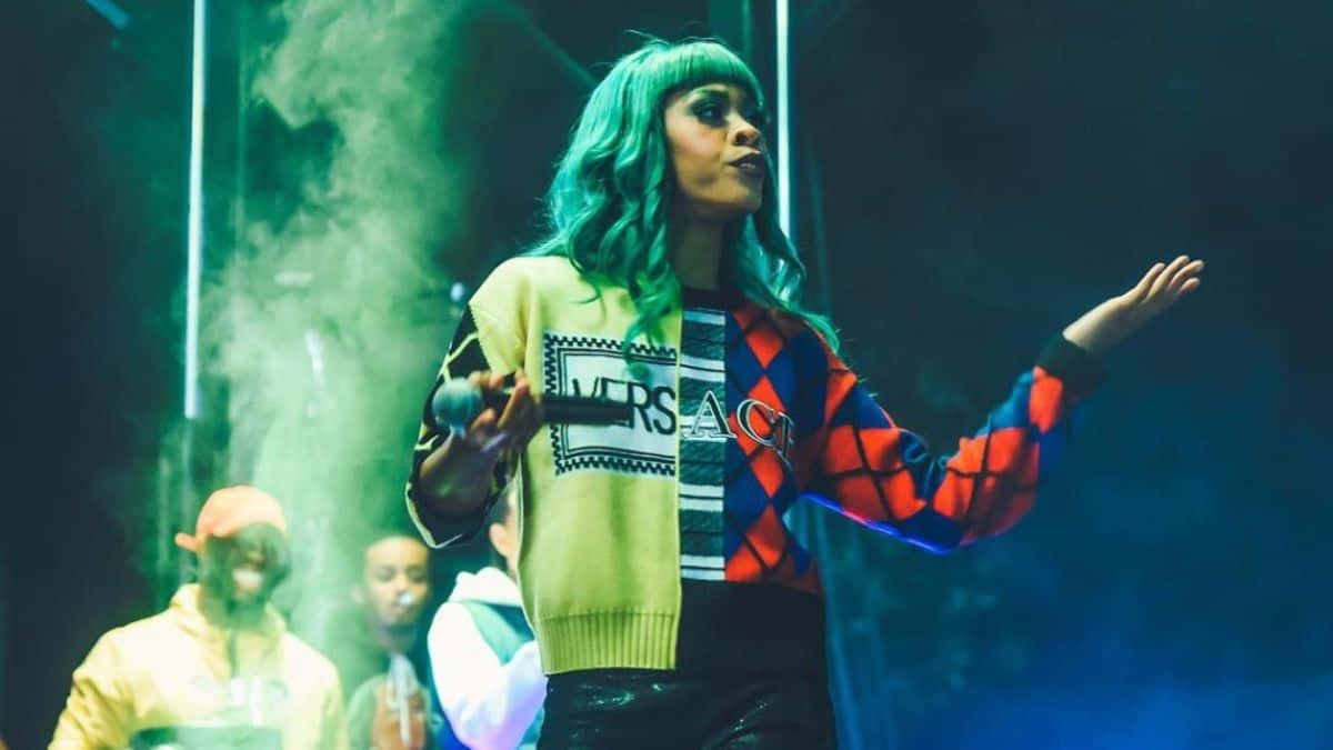 American Rapper Rico Nasty Poses In A Studio Background
