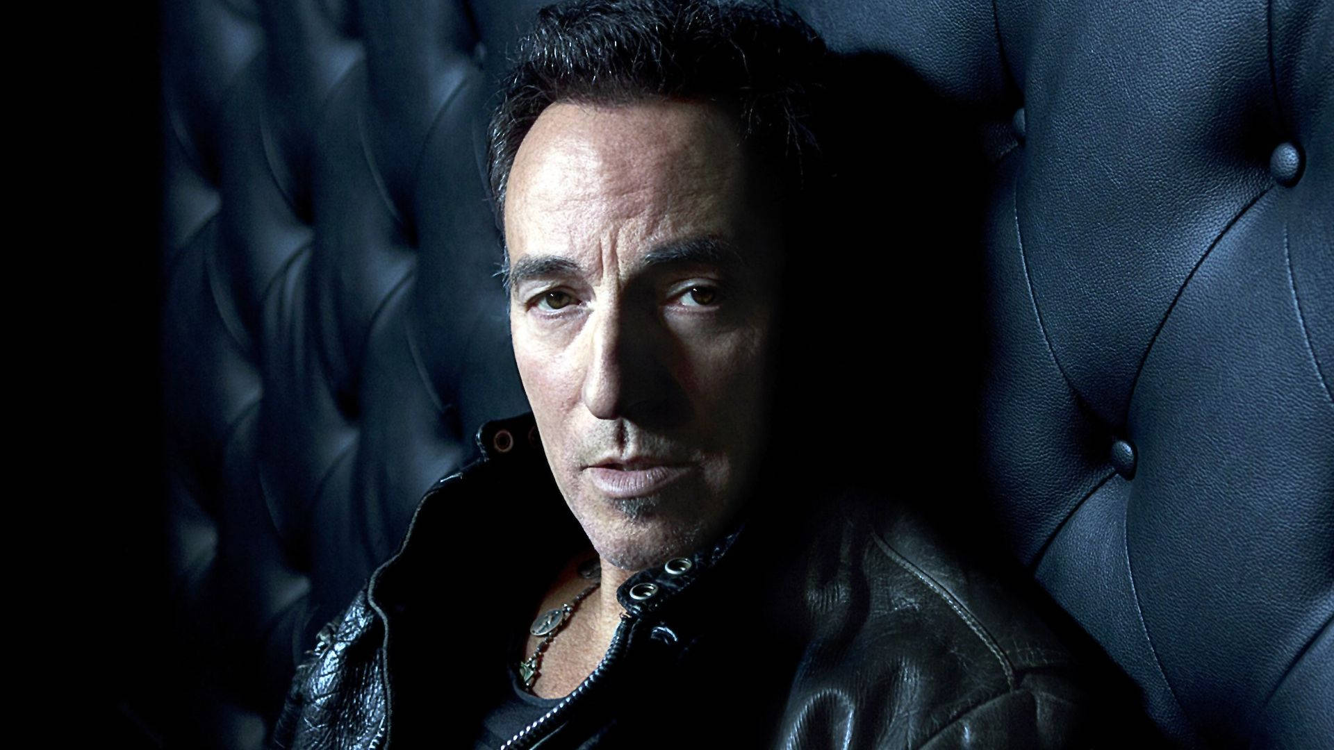 American Rocker Bruce Springsteen In Black Couch