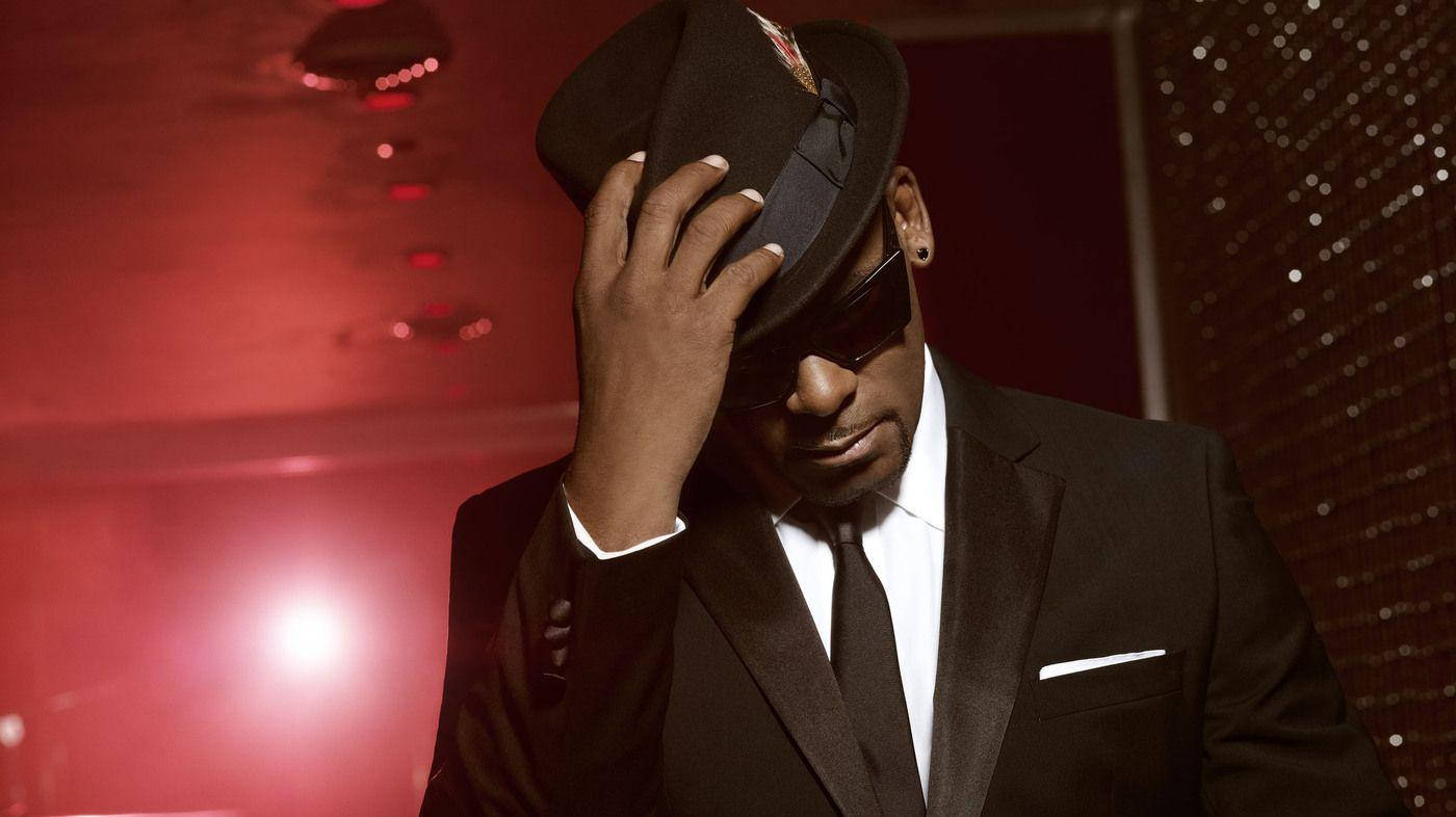 American Singer R Kelly In Black Suit Background