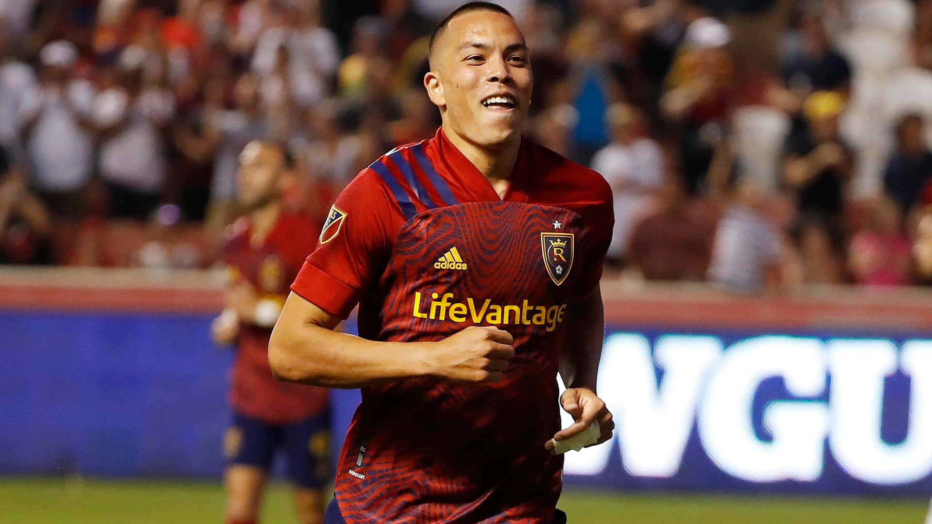 American Soccer Player Bobby Wood In Real Salt Lake Jersey Background