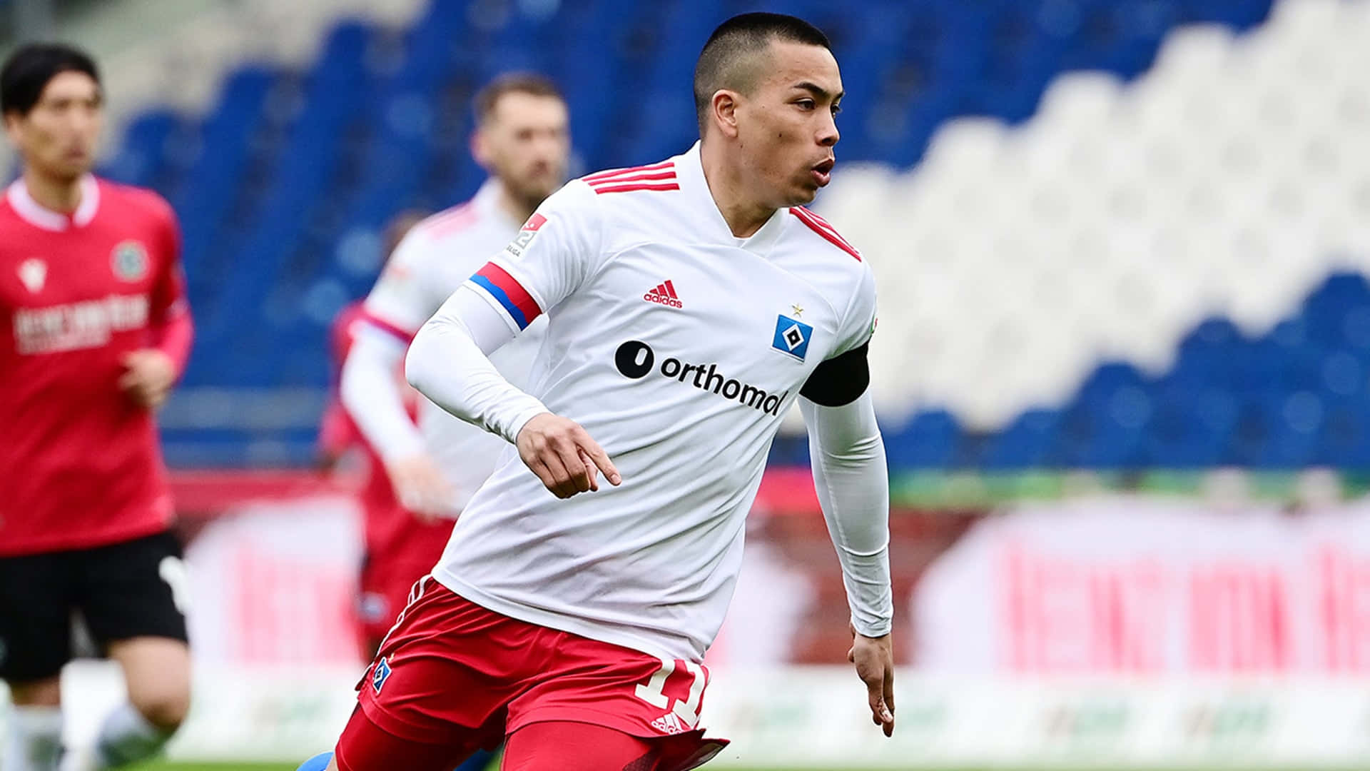 American Soccer Player Bobby Wood In White Jersey Uniform Background