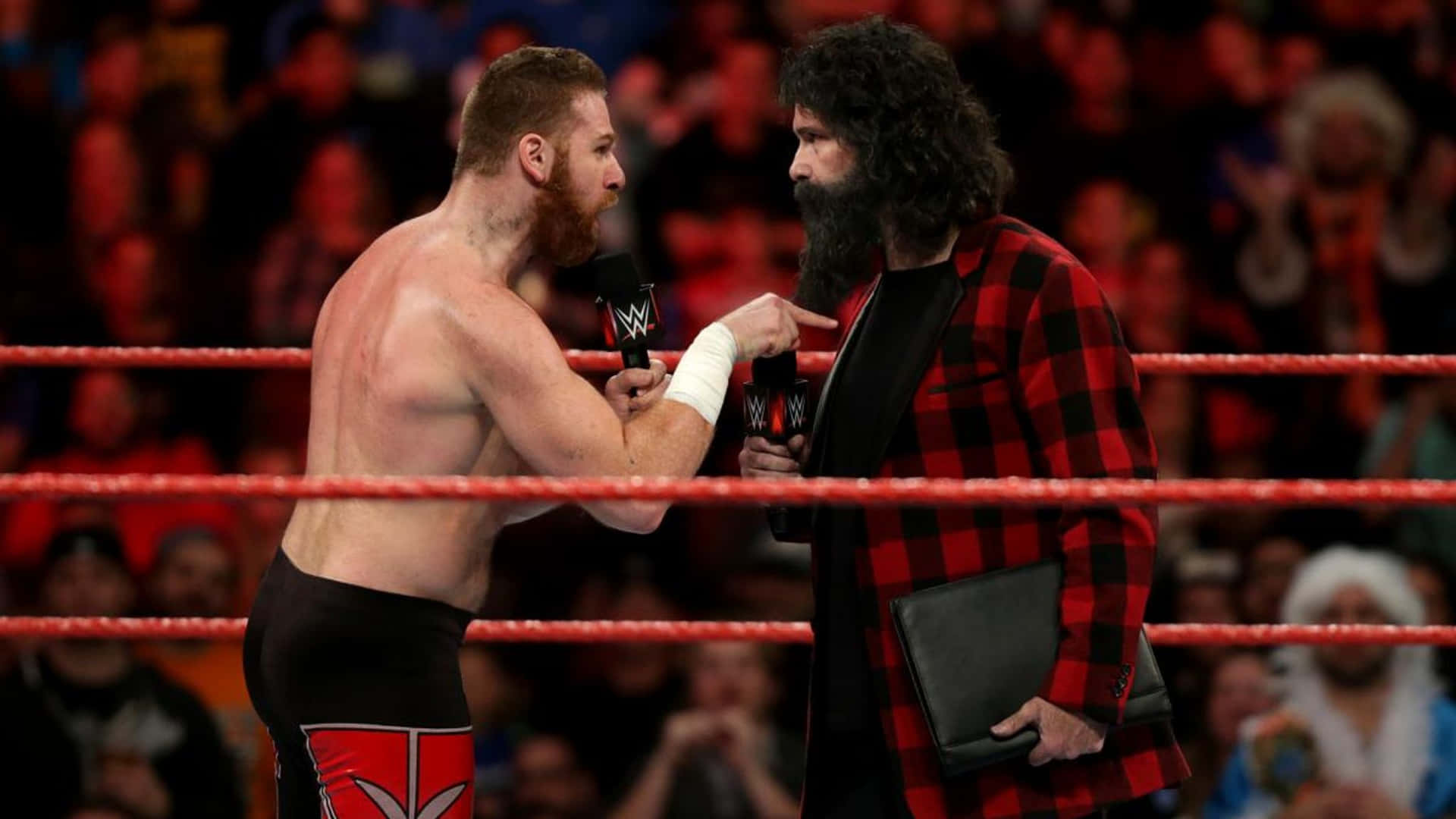 American Veteran Wrestler Mick Foley And Sami Zayn Background