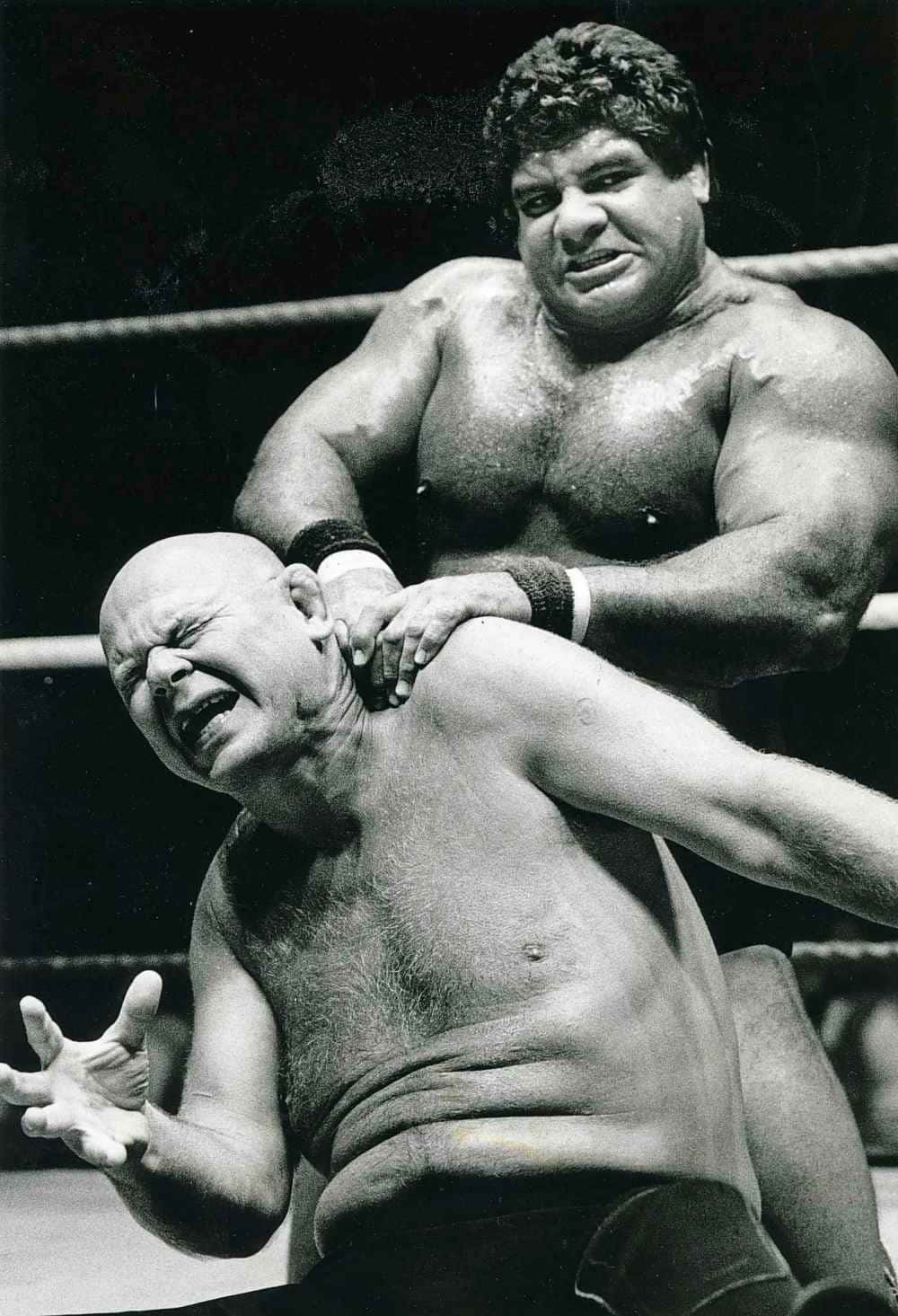 American Wrestler Baron Von Raschke Struggles Against Don Muraco Background