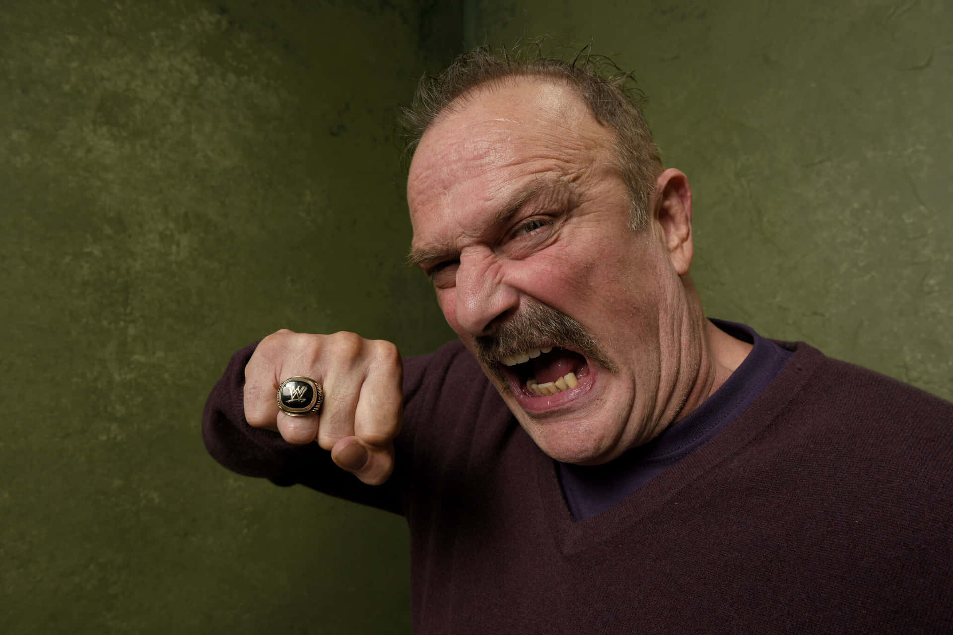American Wrestler Jake Roberts Posing In The Village At The Lift Background