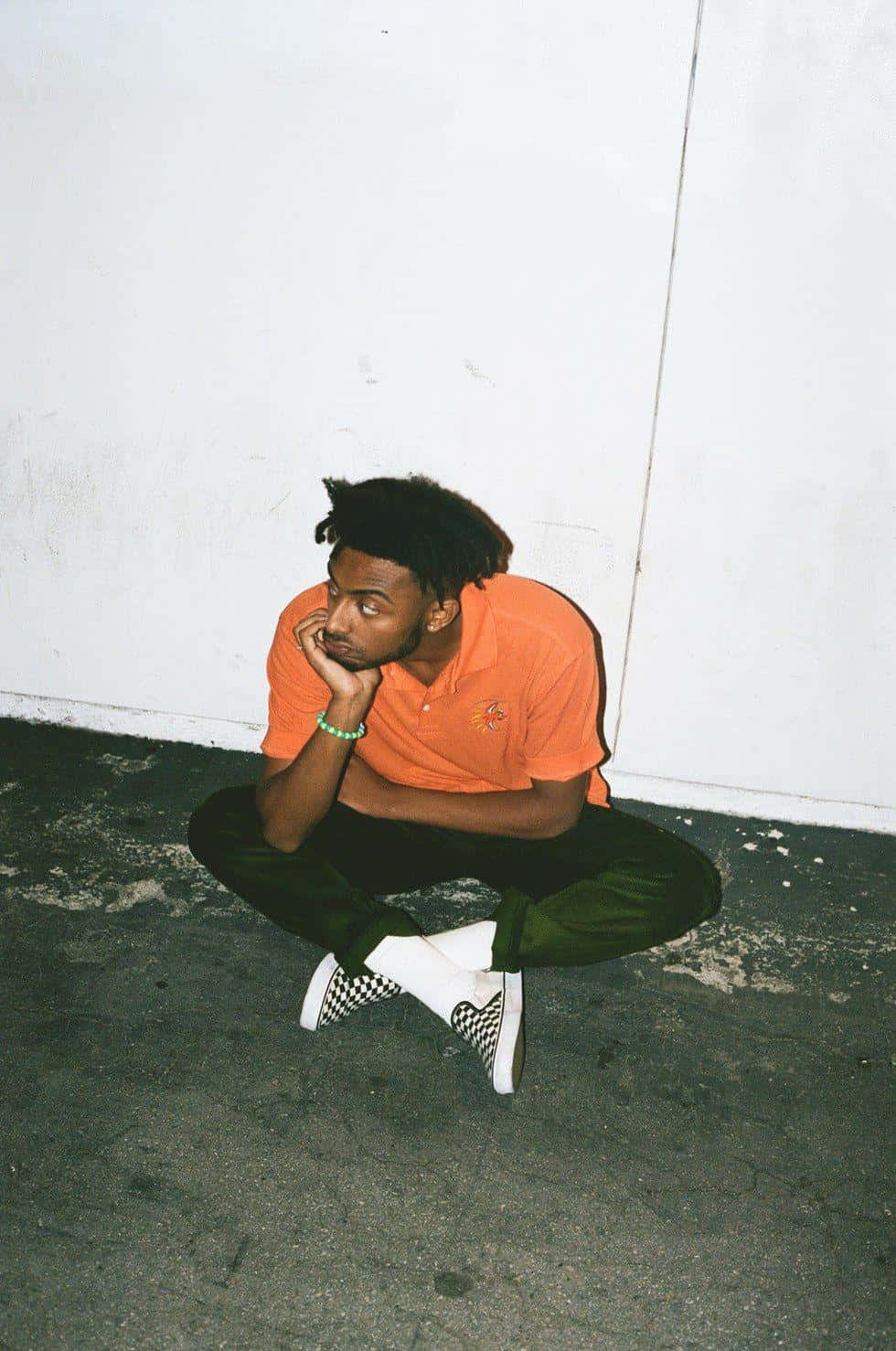 Amine Rapper Pfp Sitting On Ground Background