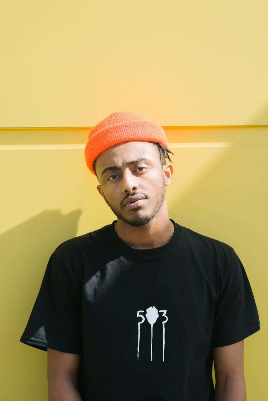 Amine Rapper Pfp With Yellow Wall Background