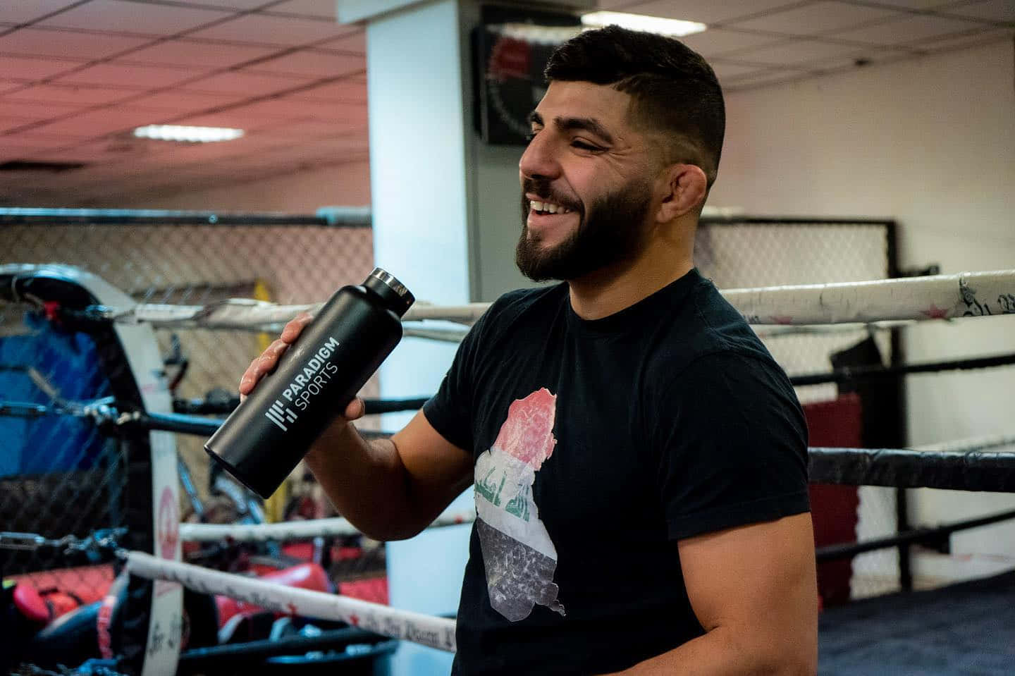 Amir Albazi Holding A Thermal Flask