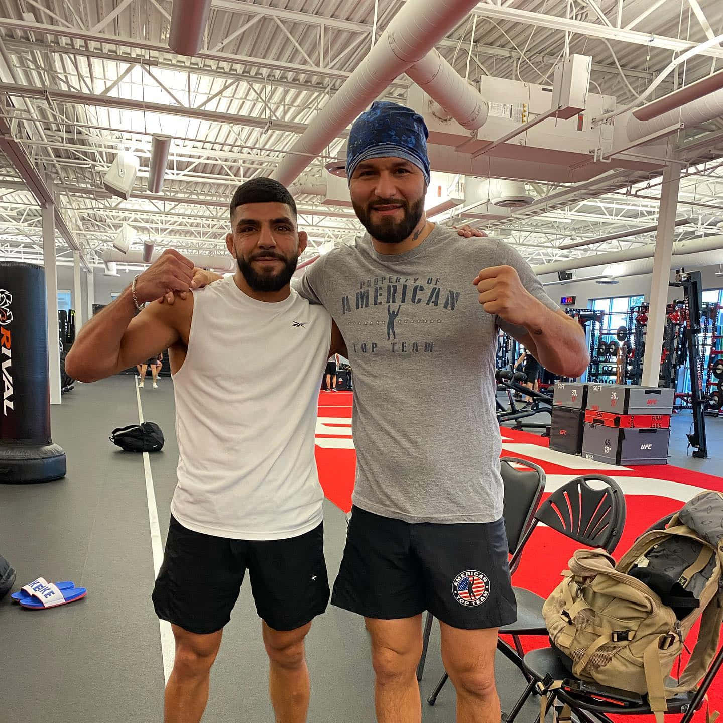 Amir Albazi In Gym With Fighter Background