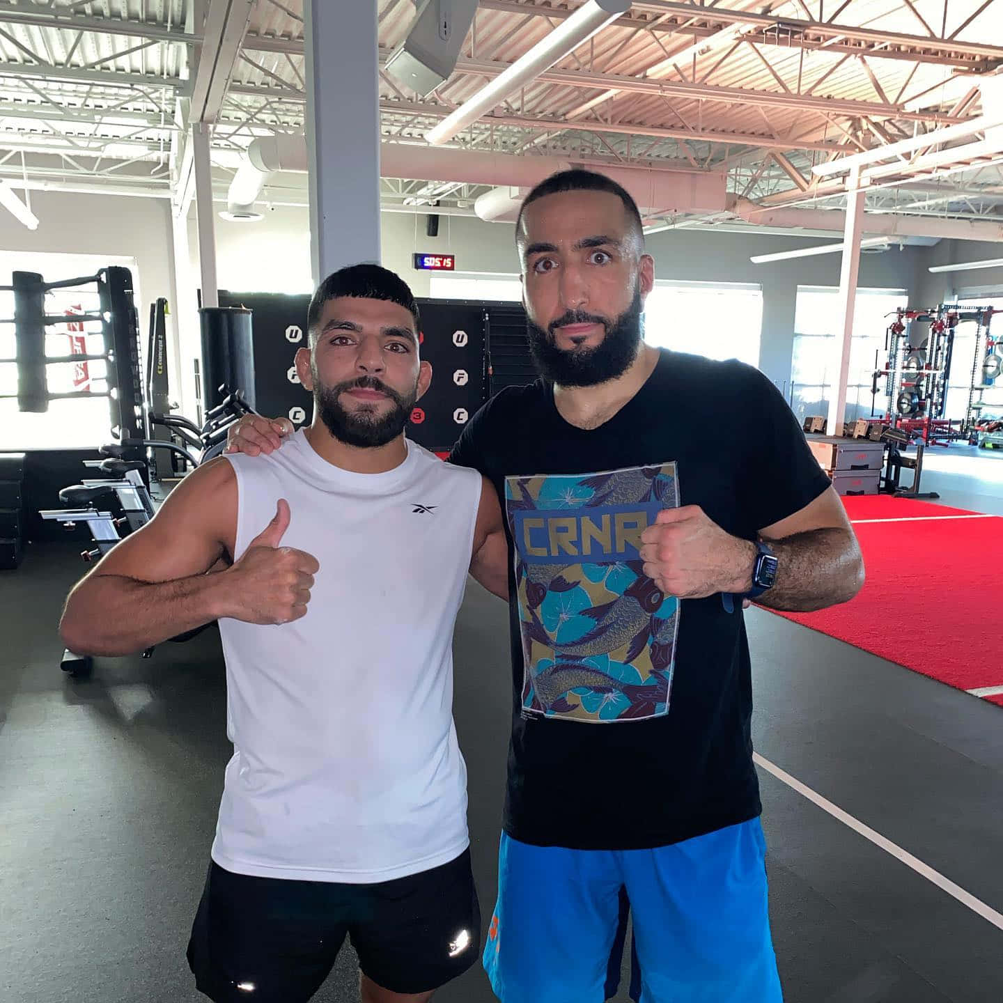 Amir Albazi Posing With Fellow Fighter