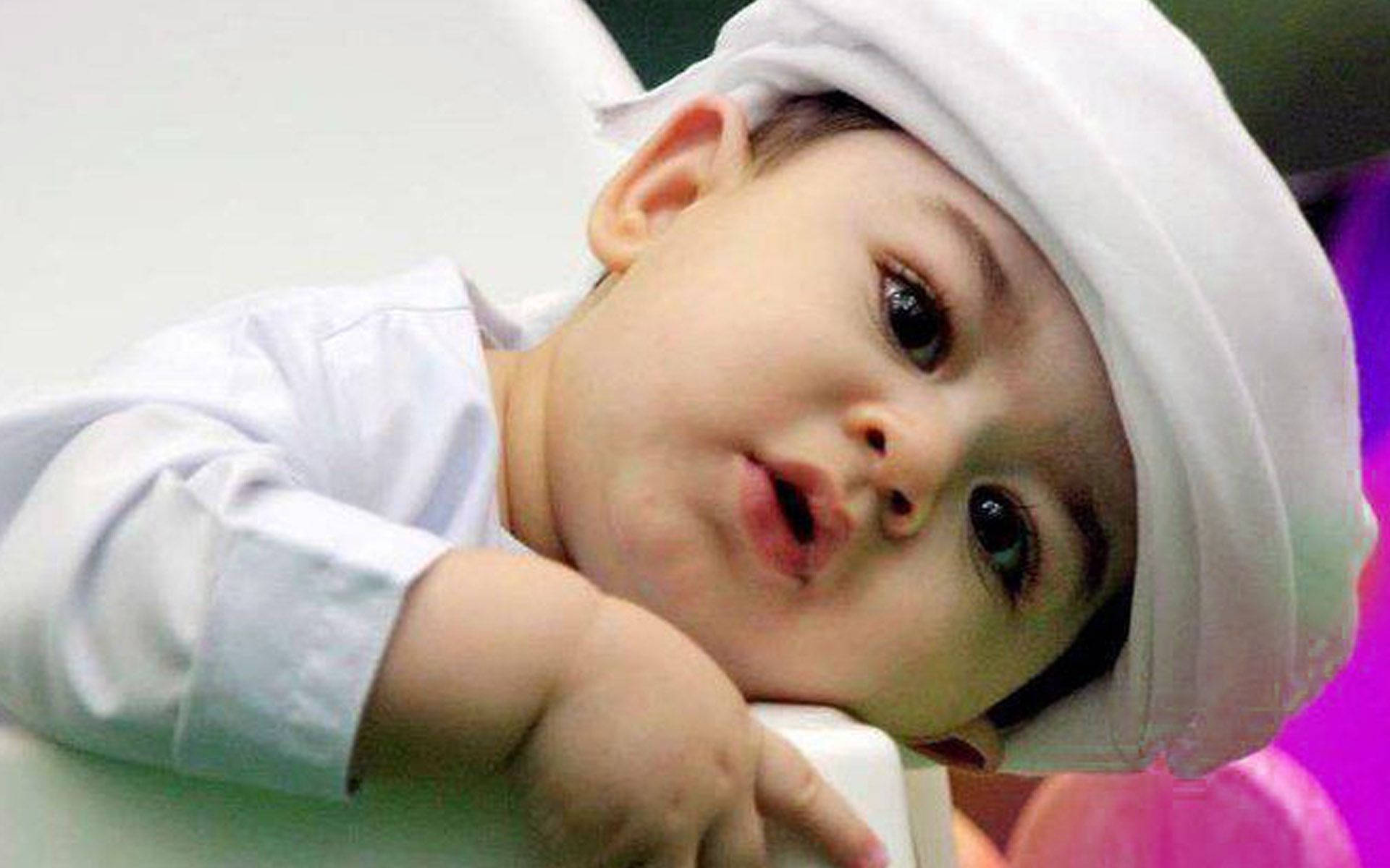 An Adorable Arab Baby Boy Wearing White Background