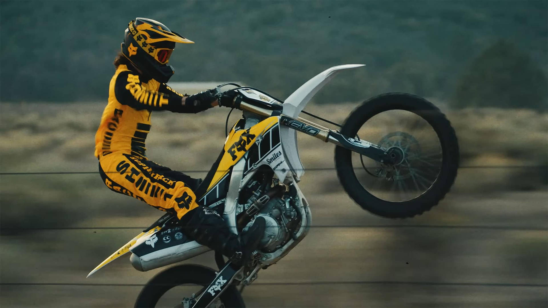 An Adrenaline-pumping Ride With Fox Dirt Bike Background