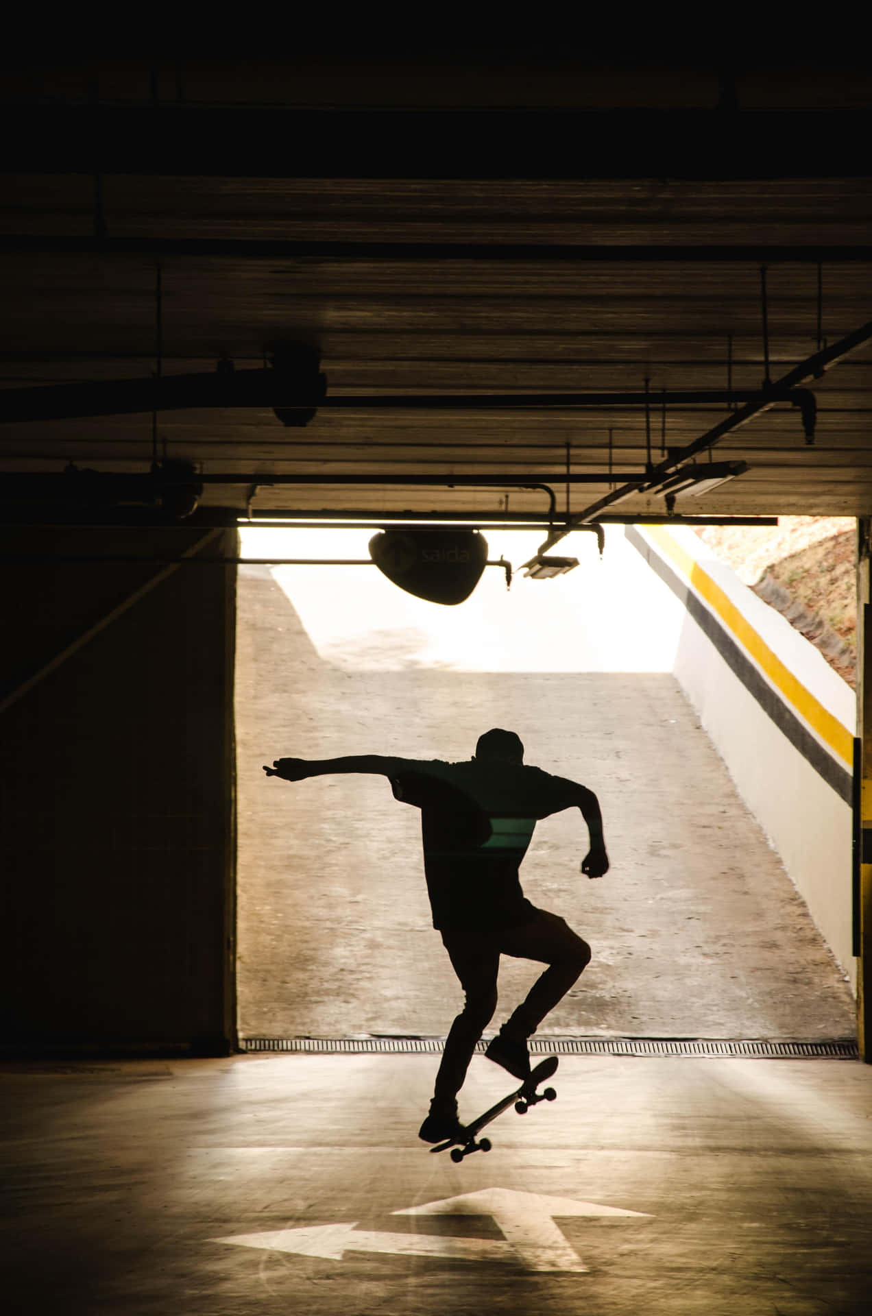 An Adventurous Street Skater Making A Daring Jump Over An Obstacle Background
