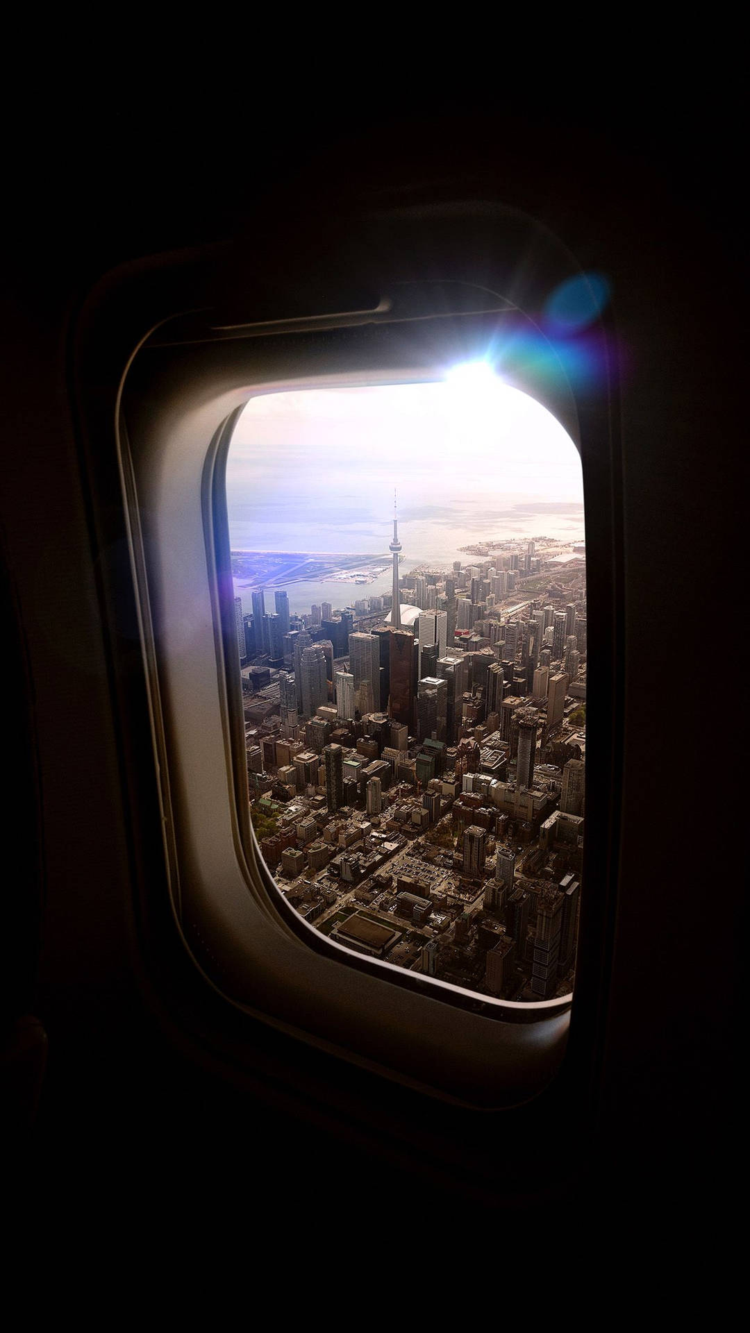 An Aerial City View From A Plane Window Background