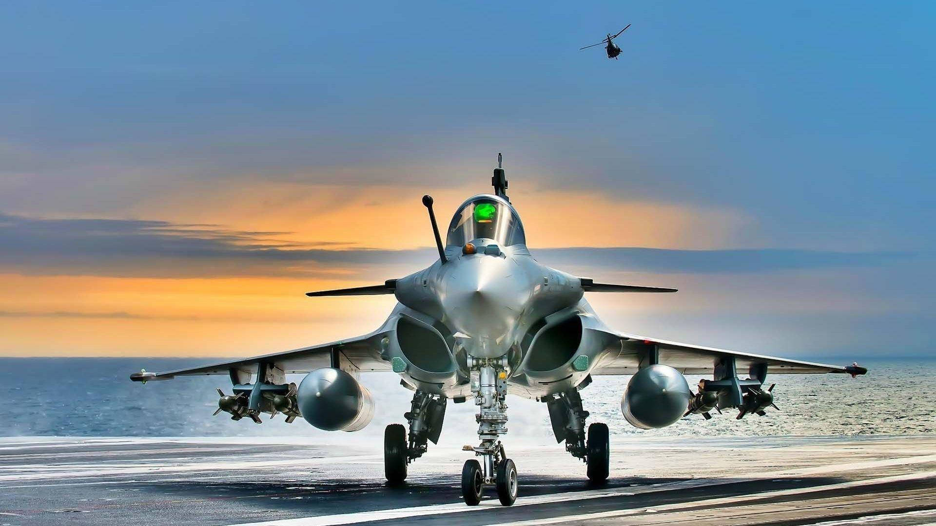 An Aerial View Of A Jet Flying Through The Skies Background