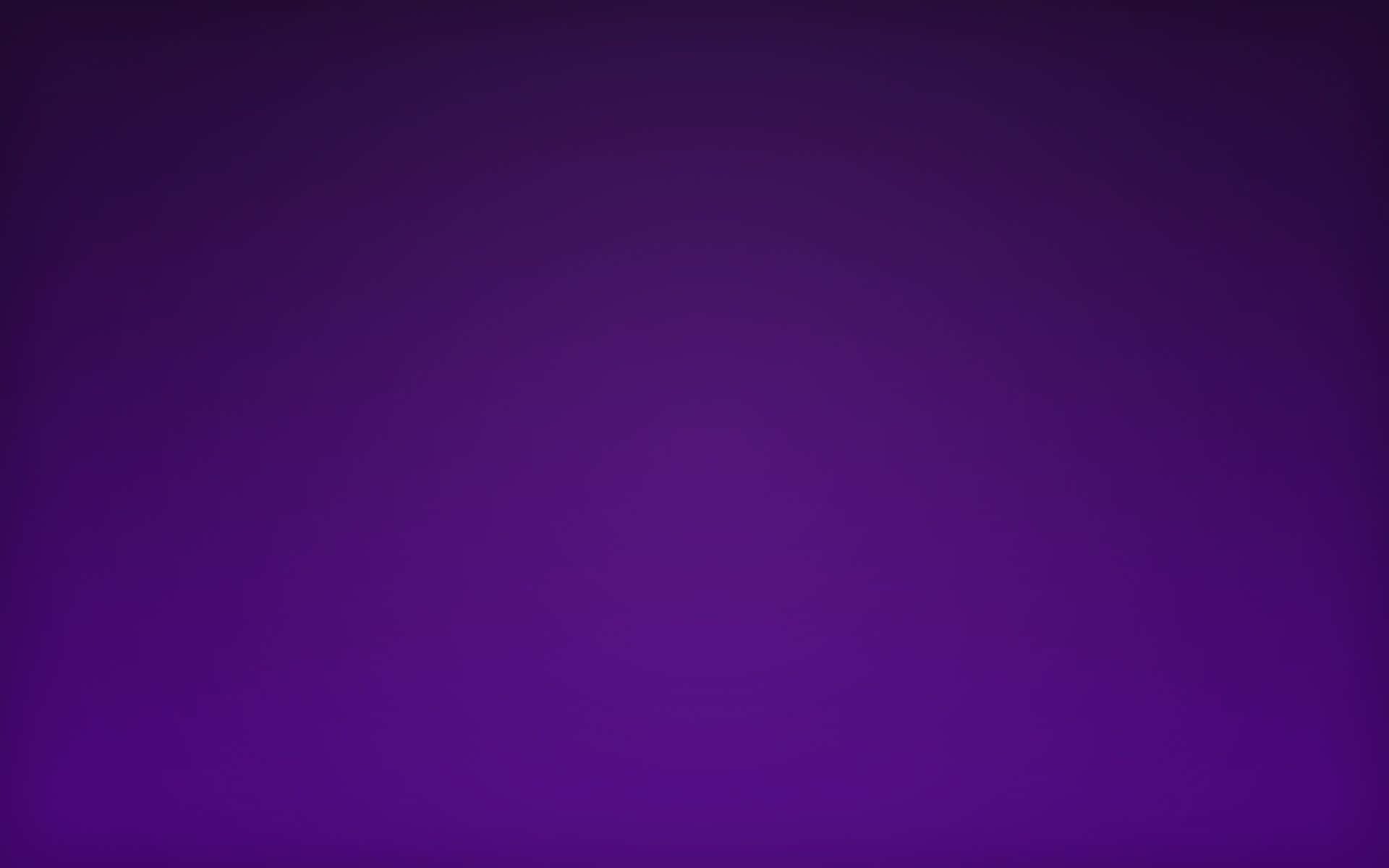 An Aesthetically Pleasing Home Office Setup Featuring A Purple Desktop