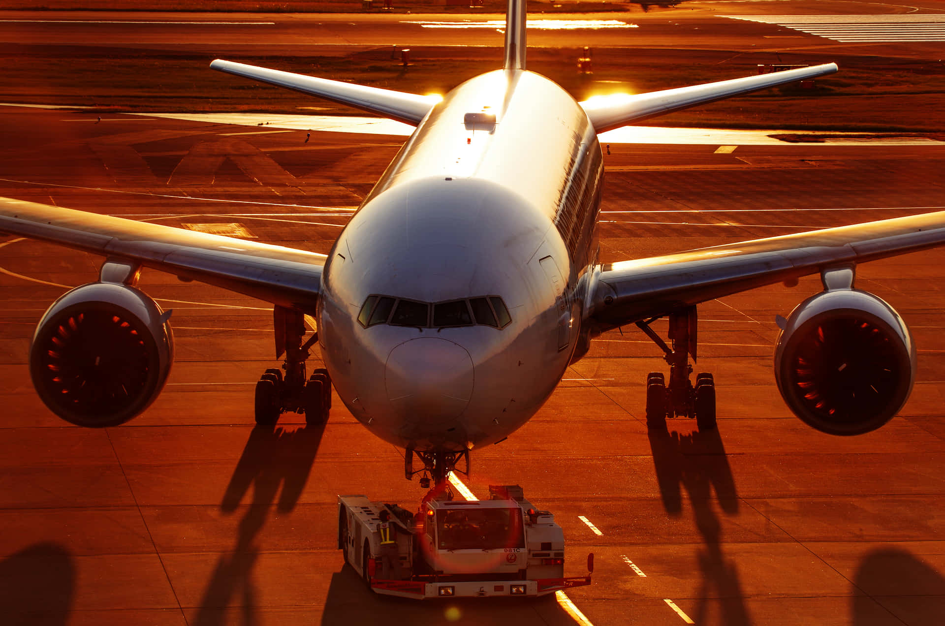 An Airliner Carrying Passengers Across The Globe Background