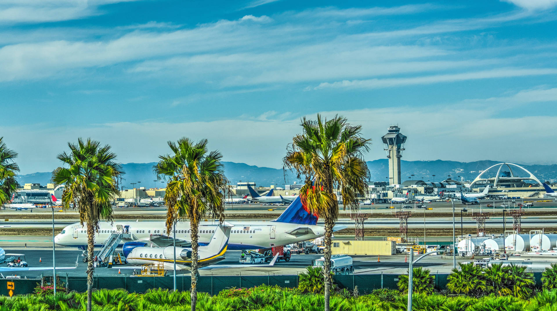 An Airplane Parked In The Tom Bradley International Terminal Of Los Angeles International Airport (lax). Background