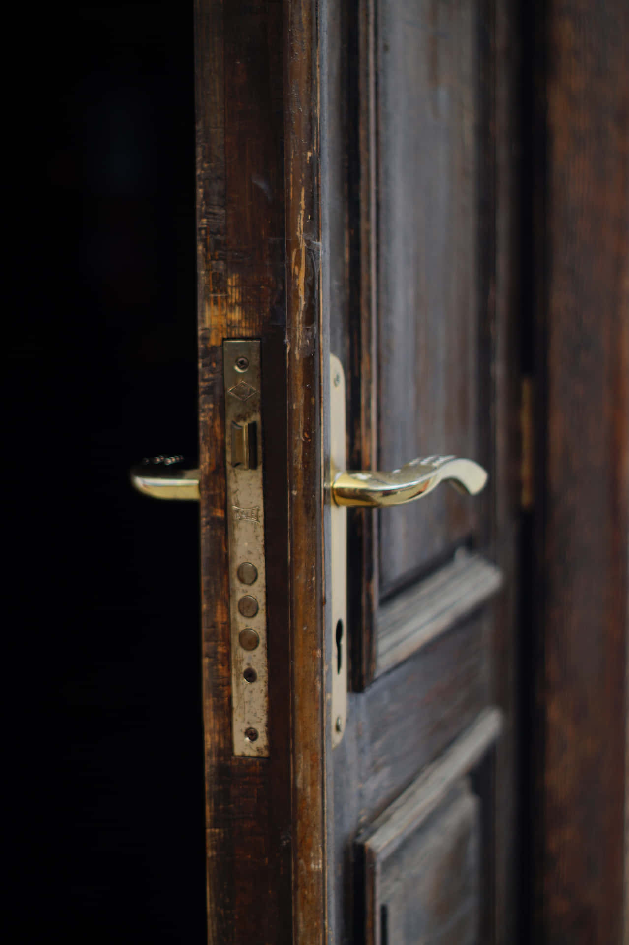 An Antique Open Door Inviting Exploration Background