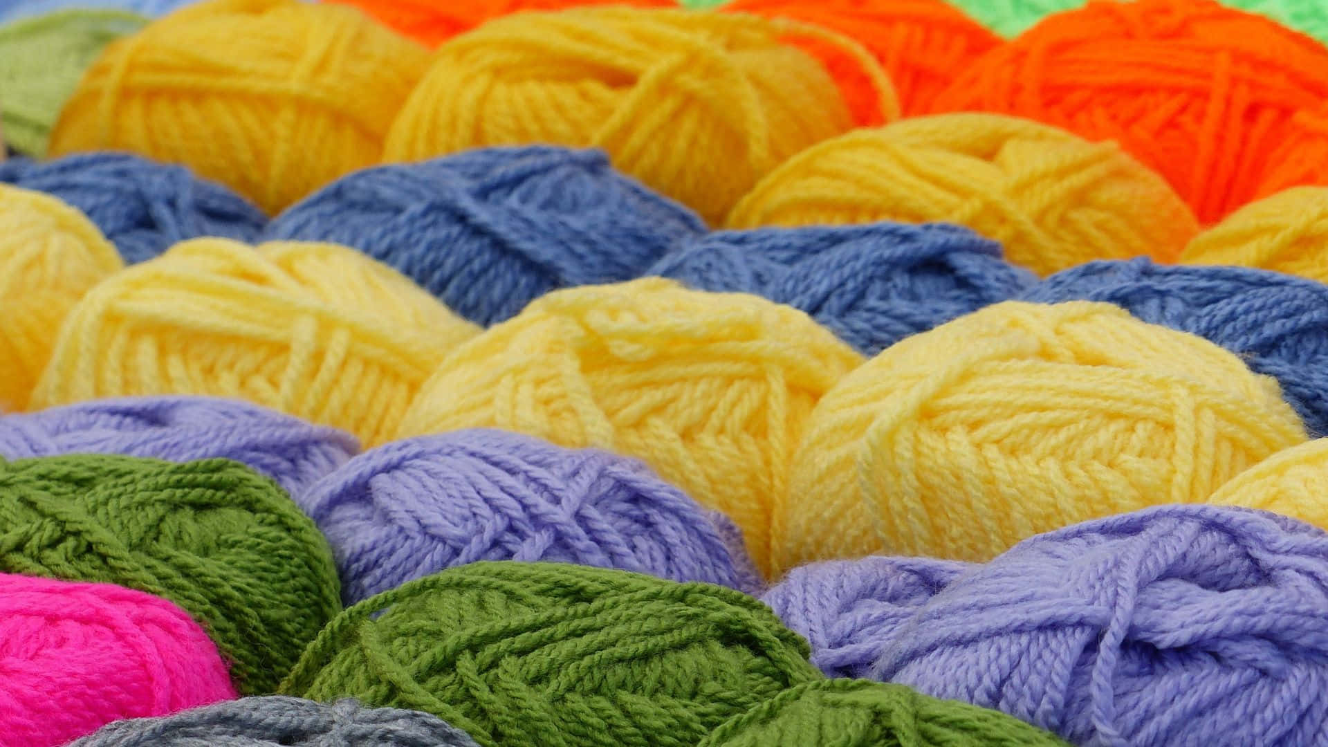 An Array Of Knitting Yarns In Selective Focus Background