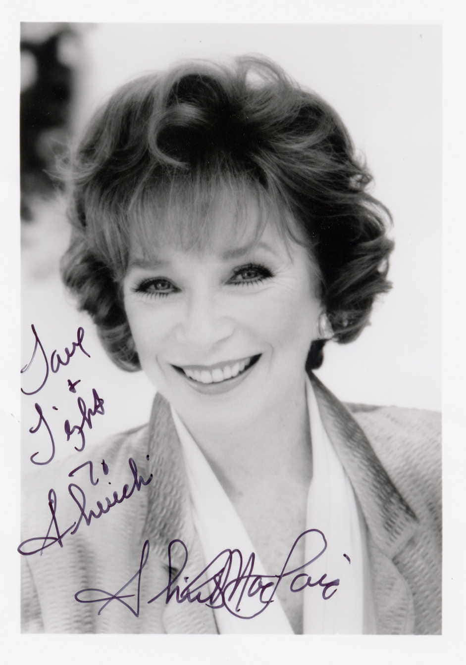 An Autographed Image Of Shirley Maclaine Background