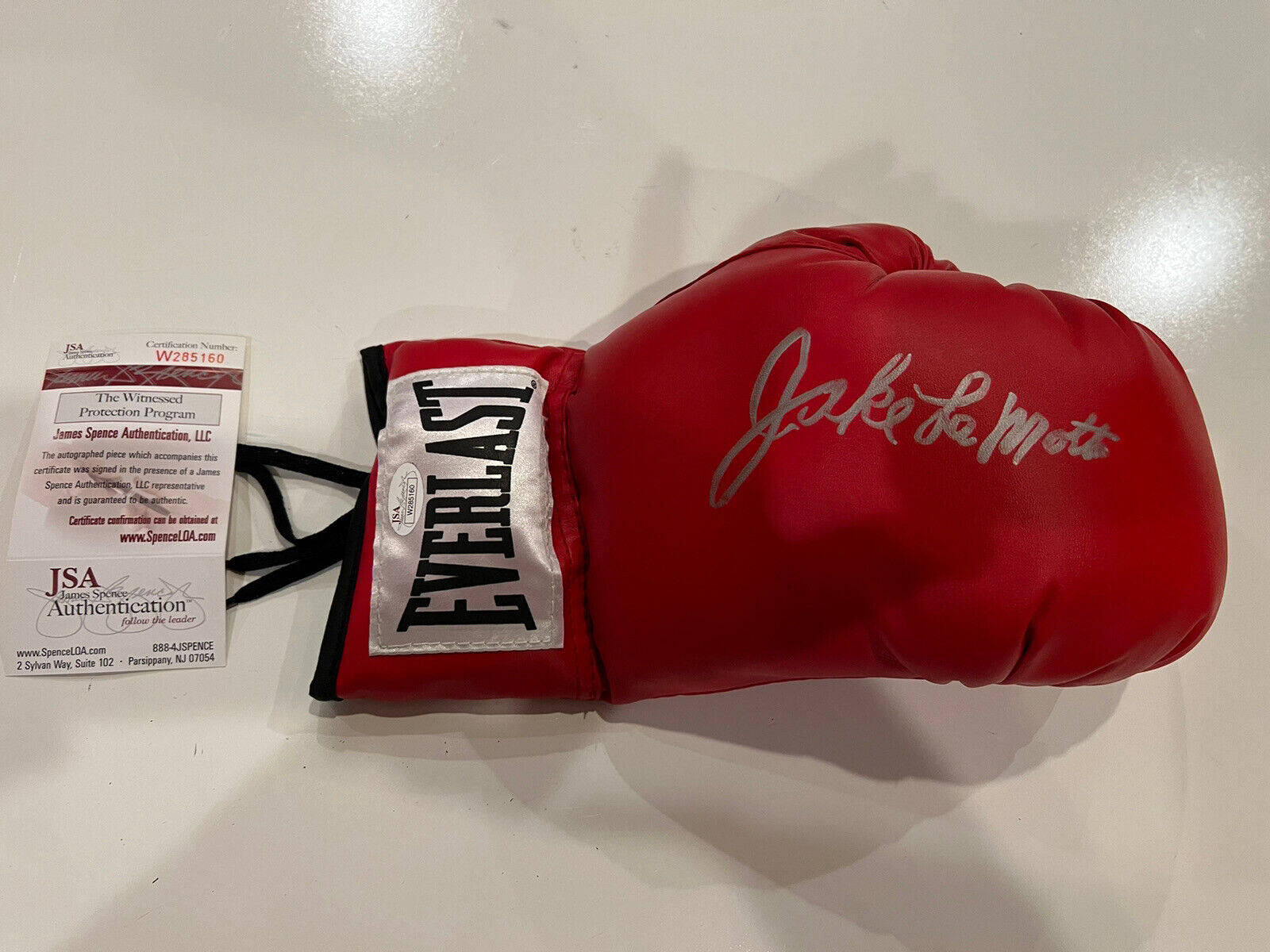 An Autographed Jake Lamotta Boxing Glove Background