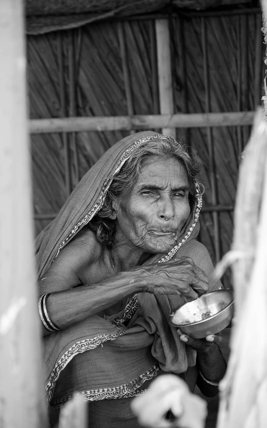 An Elderly Woman Enjoying A Peaceful Meal Background