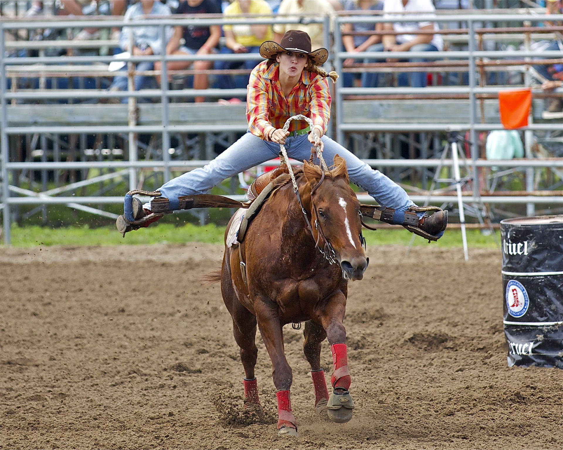 An Electrifying Moment Of Barrel Racing In Action Background