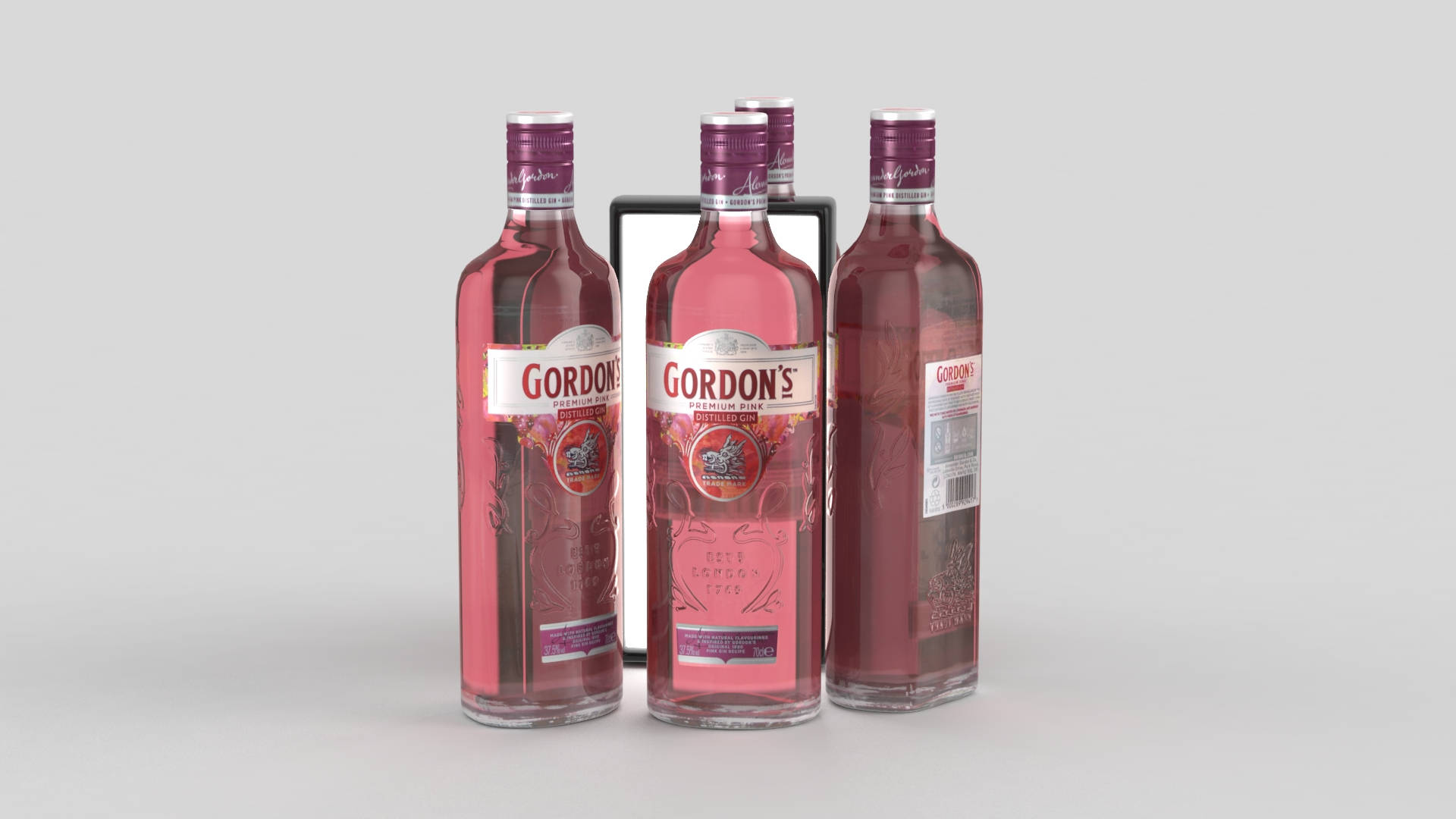 An Enthralling View Of Four Gordon's Premium Pink Gin Bottles Aligned In A Row. Background