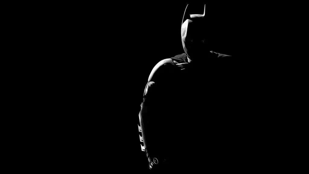 An Epic Scene Of Batman Taking Over Gotham City Background