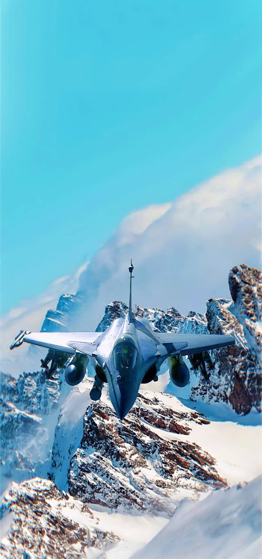 An Epic Shot Of A Fighter Jet Over Snow Capped Mountains As Wallpaper For Iphone