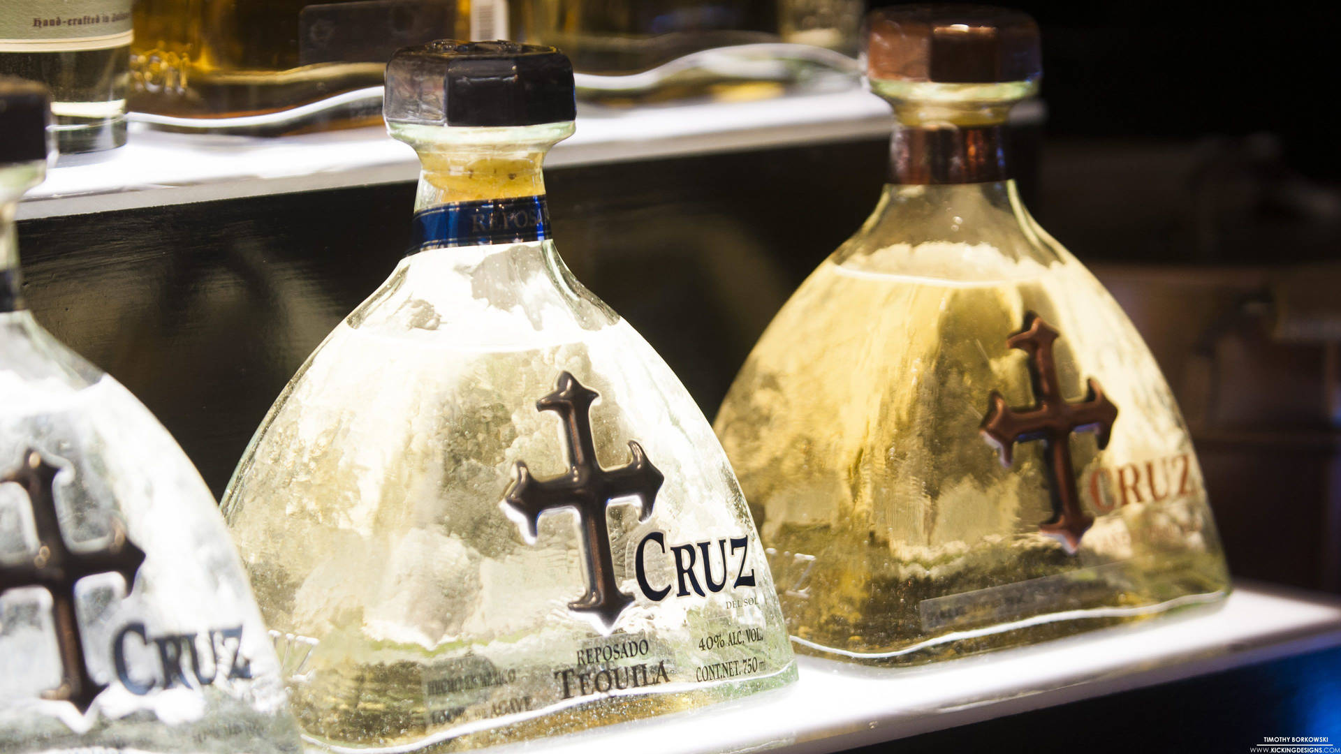 An Exquisite Display Of Cruz Tequila Bottles Background