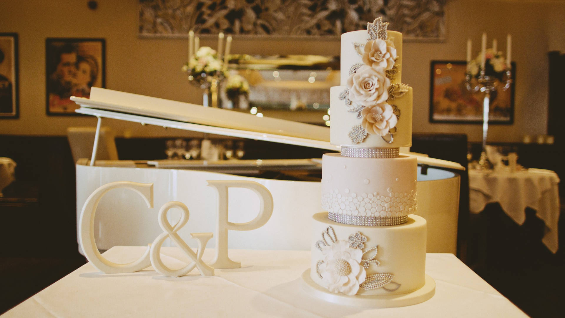 An Exquisite Four-tier White Wedding Cake Adorned With Beautiful Roses. Background