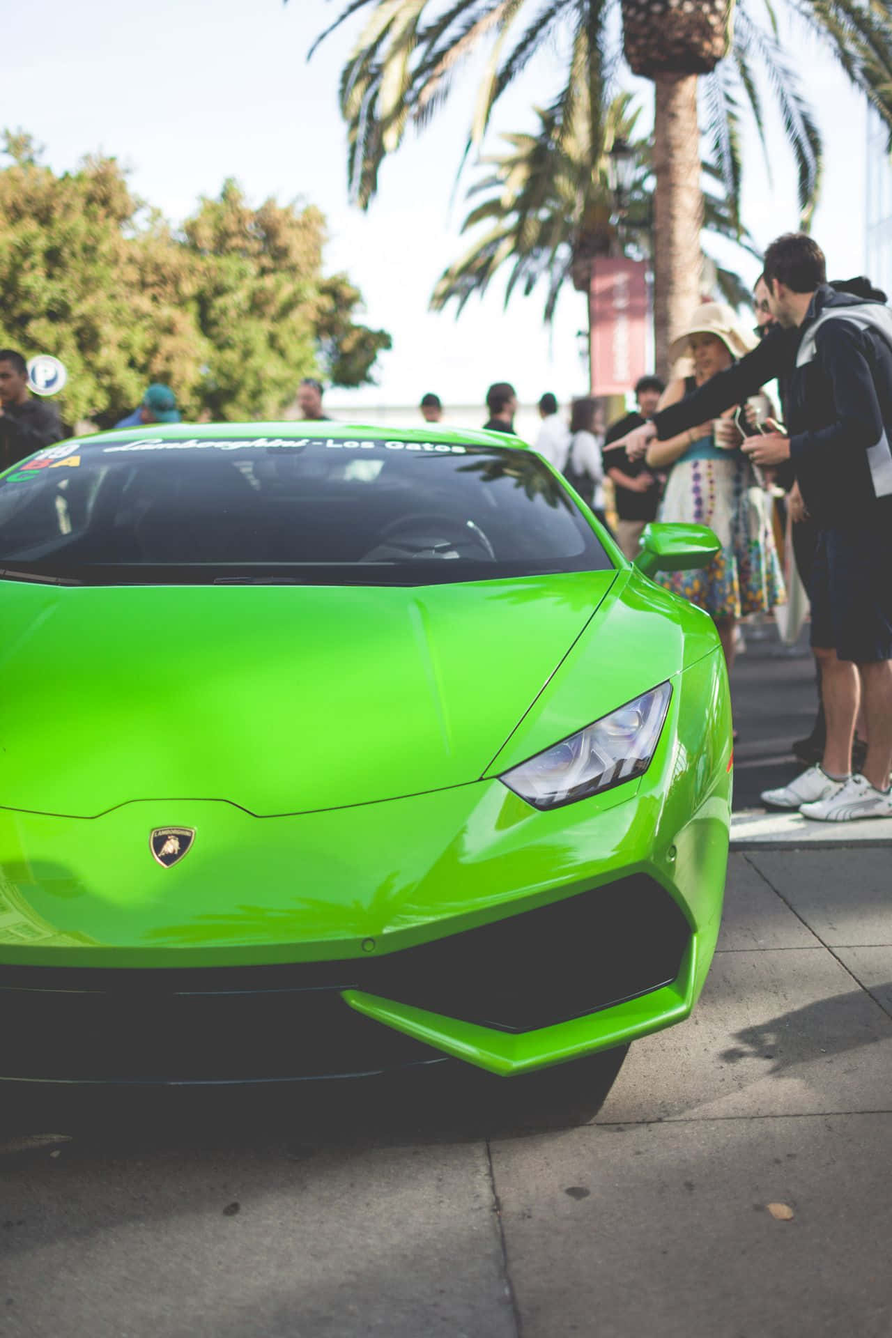 An Exquisite Green Lamborghini Crafted For Iphone Background