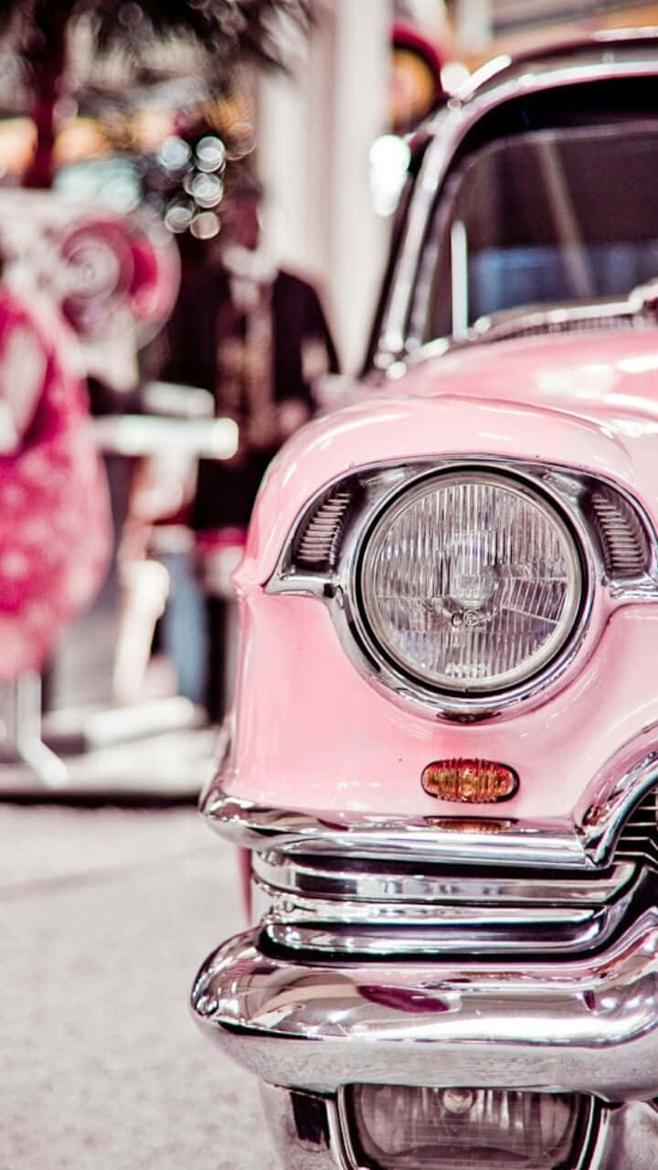 An Eye-catching Pink Vintage Car Background