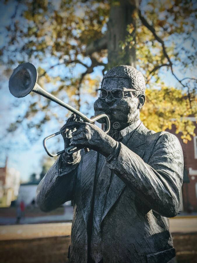 An Inspirational Statue Of Dizzy Gillespie In South Carolina Background