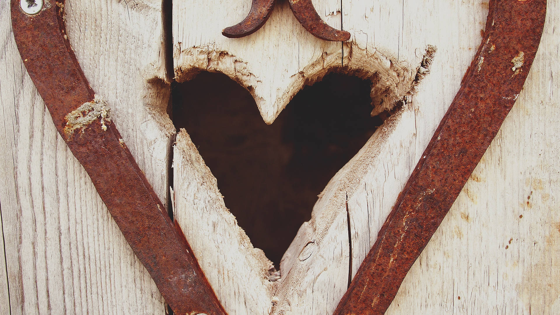 An Intricately Detailed Vintage Heart Carved Out Of Wood. Background