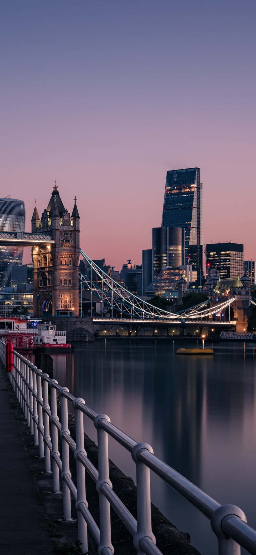 An Iphone Towers Over London’s Iconic Skyline. Background