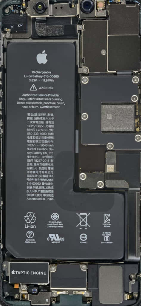 An Iphone With Its Motherboard Removed Background