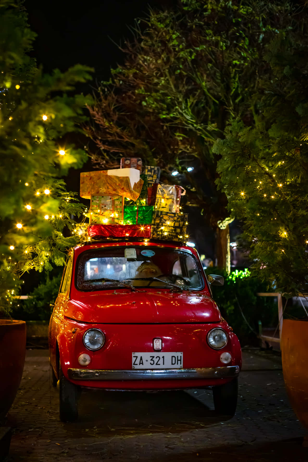 An Old-fashioned Red Pickup Truck Festively Decorated For Christmas Background